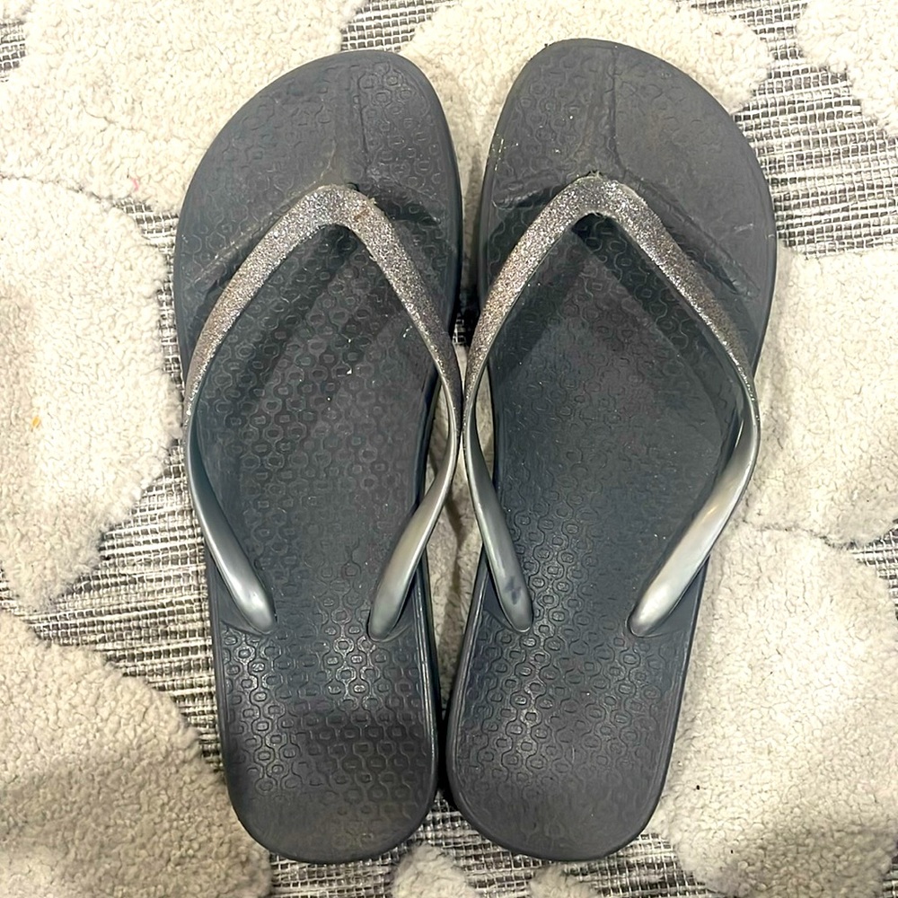 Sparkly silver flip flops